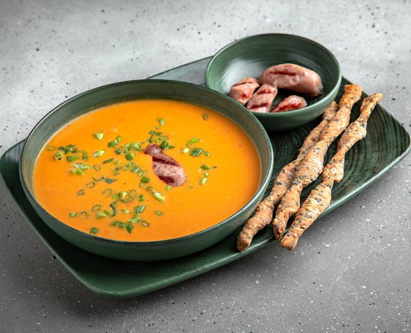 Cheese cream soup with sausages and bacon