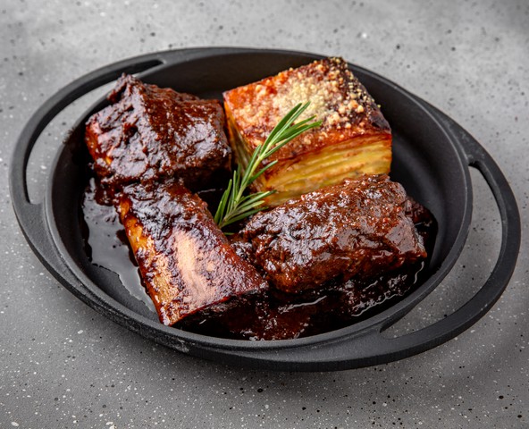 Beef ribs stewed in red wine with potato gratin