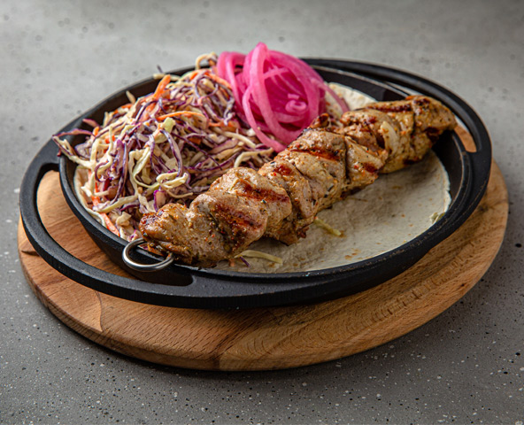 Pork skewers with lavash and salad