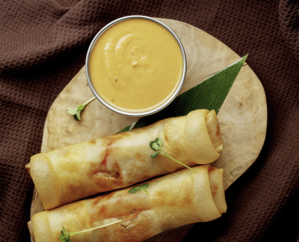 Spring rolls with mushrooms and walnut sauce