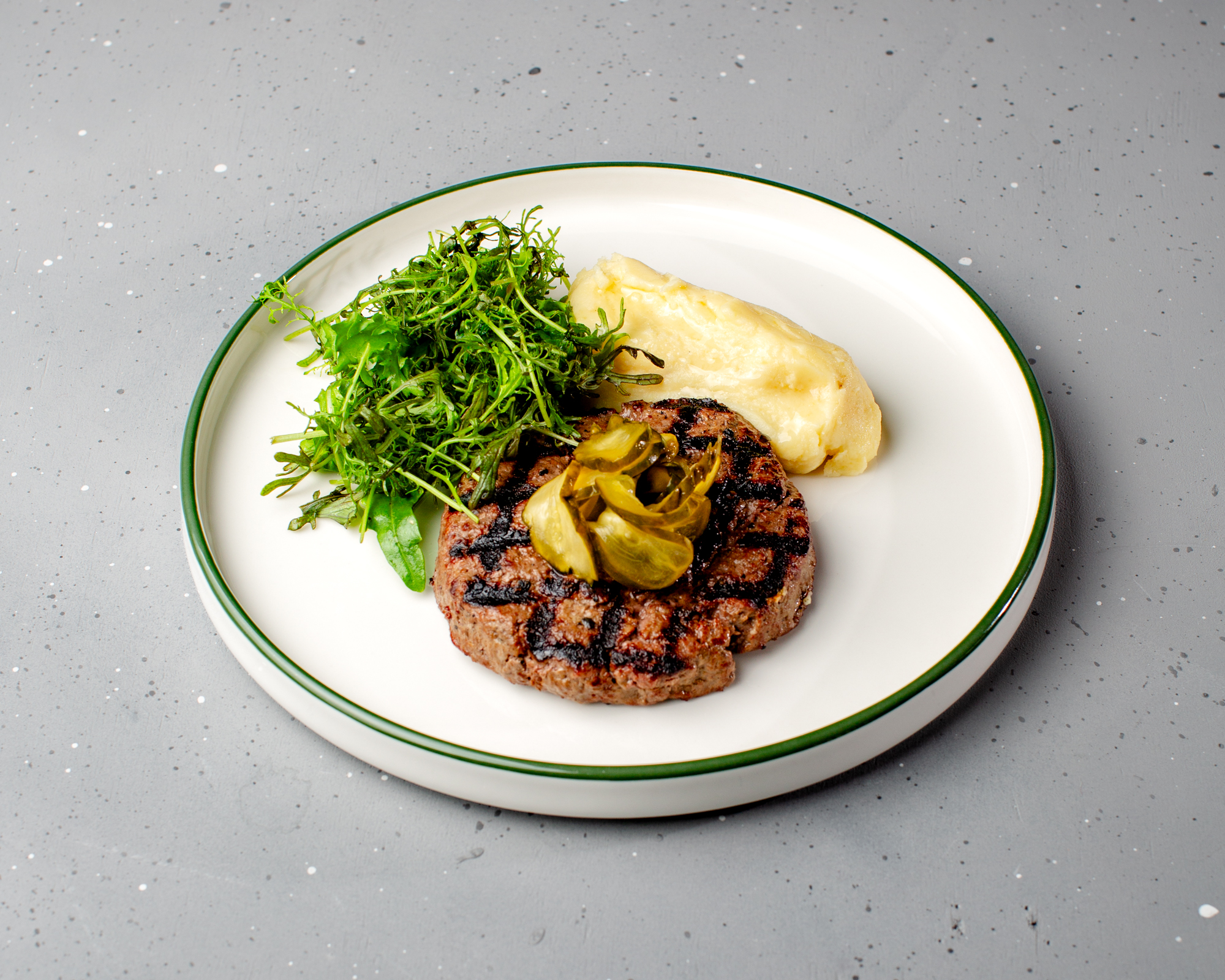 Steak with mashed potatoes, and smashed cucumbers