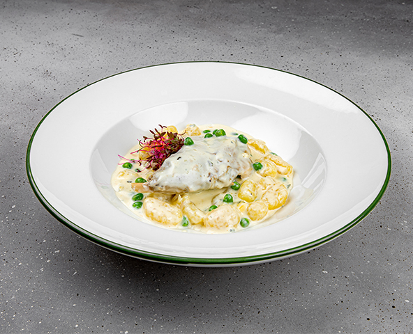 Rabbit leg with gnocchi and creamy sauce